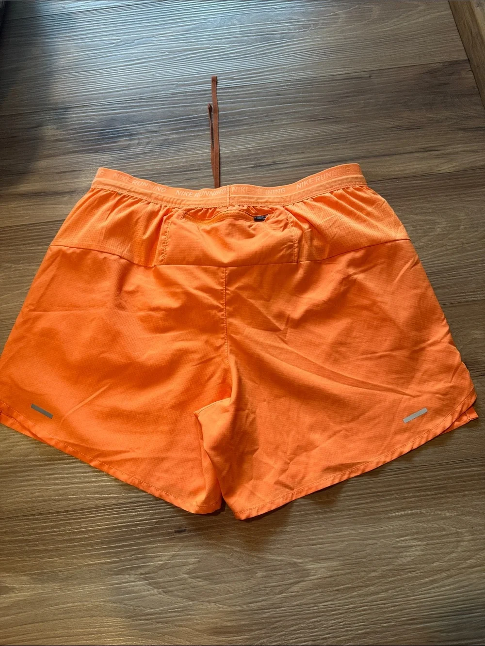 Nike Orange Athletic Running Shorts with Reflective Swoosh